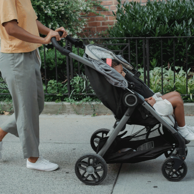 woman walking with stoller with baby in it