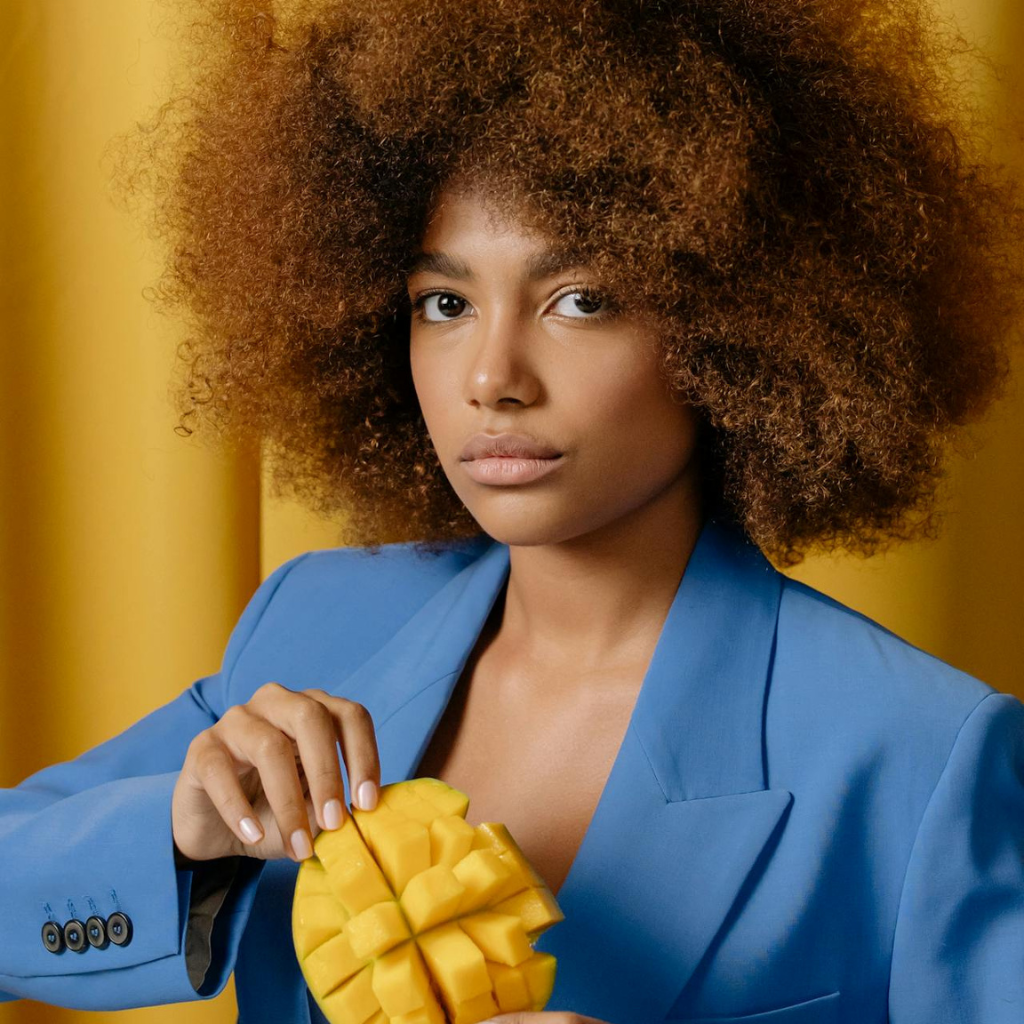 Woman holding mango