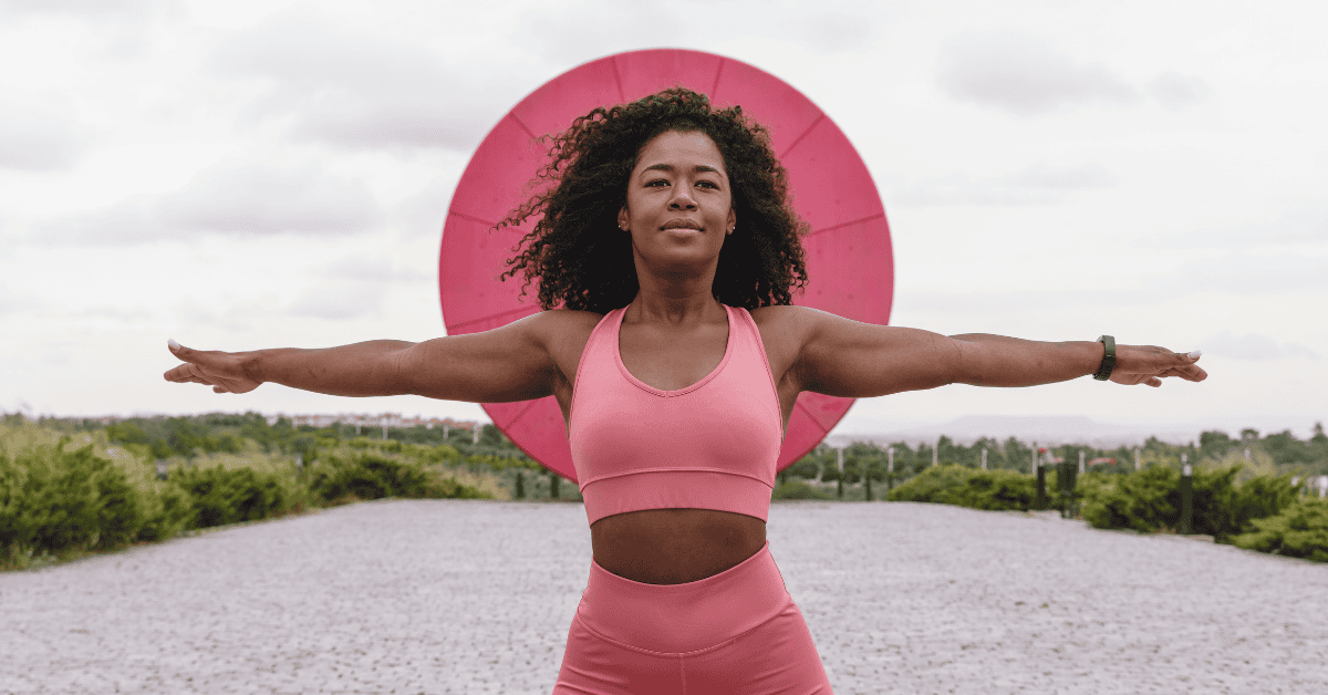 Woman working wearing all pink gym wear