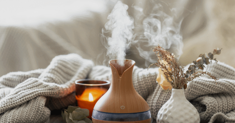 diffuser with basil essential oils in cozy home