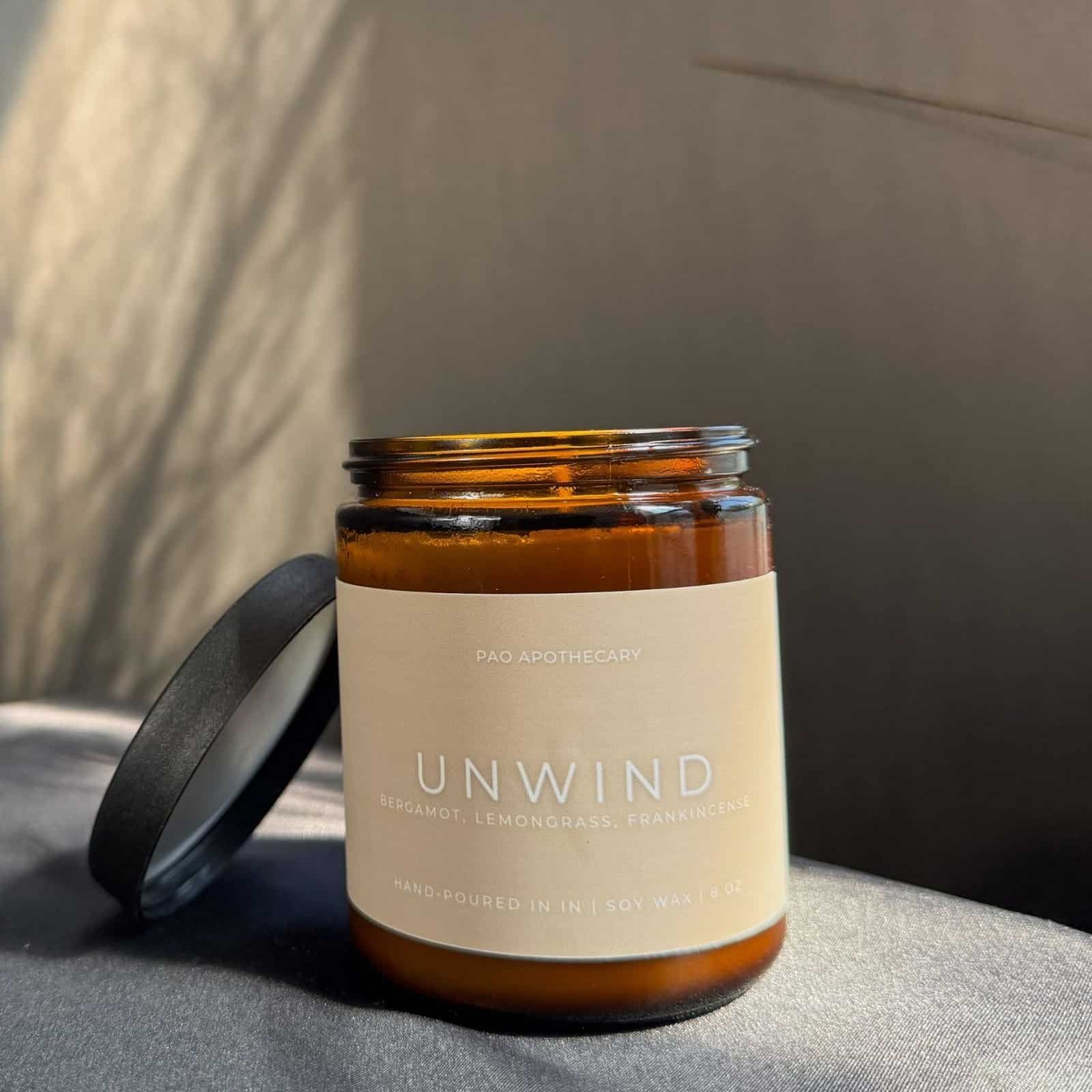 Unwind candle with bergamot, lemongrass, and frankincense