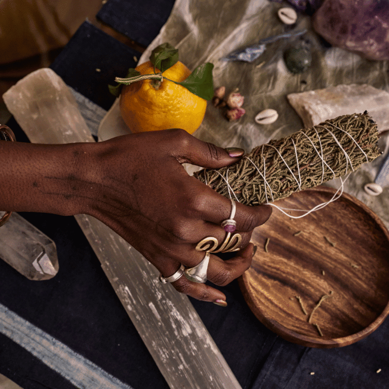 woman holding sage in an end of year reflections